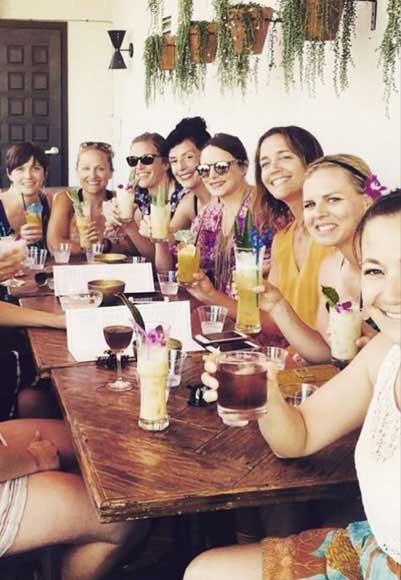 Group of ladies enjoying their tiki drinks.